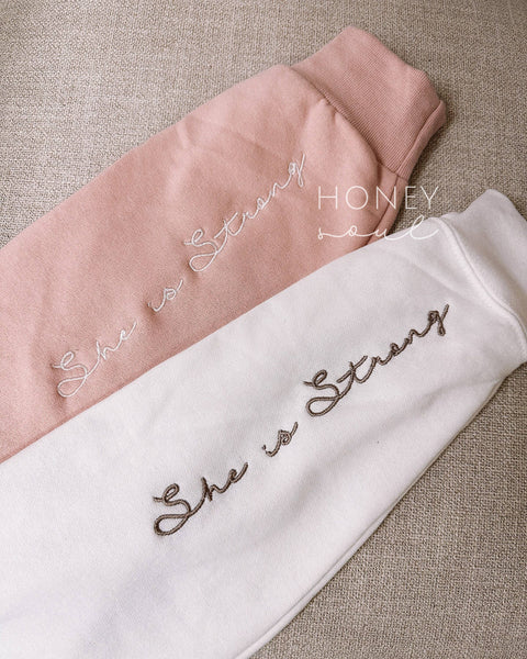 Embroidered She Is Strong Sweatshirt Blush Pink